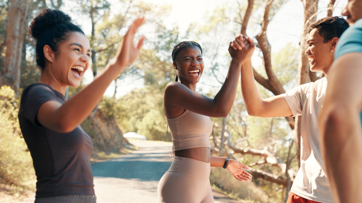 Happy people celebrating fitness success